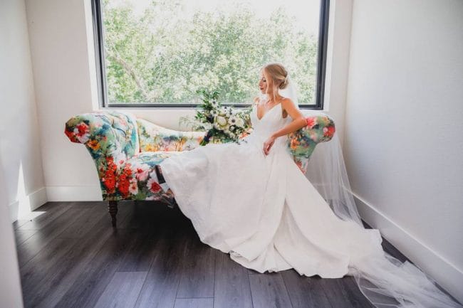 bride sitting on couch at Osage house