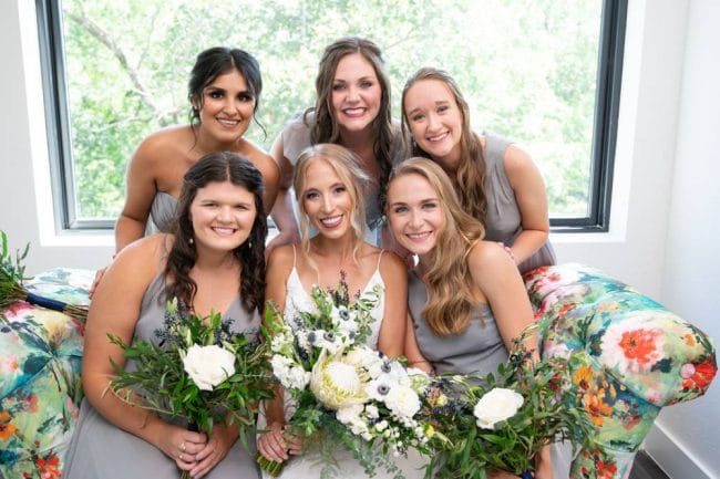 bridesmaids on couch with bride